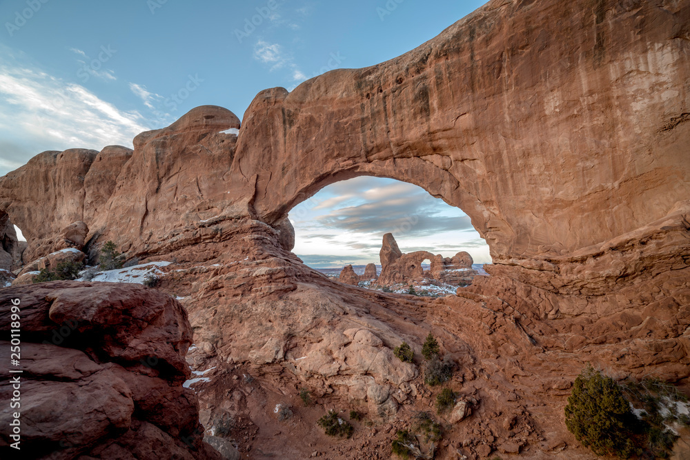 Famous Turret Arch in Utah in the morning as seen through another one