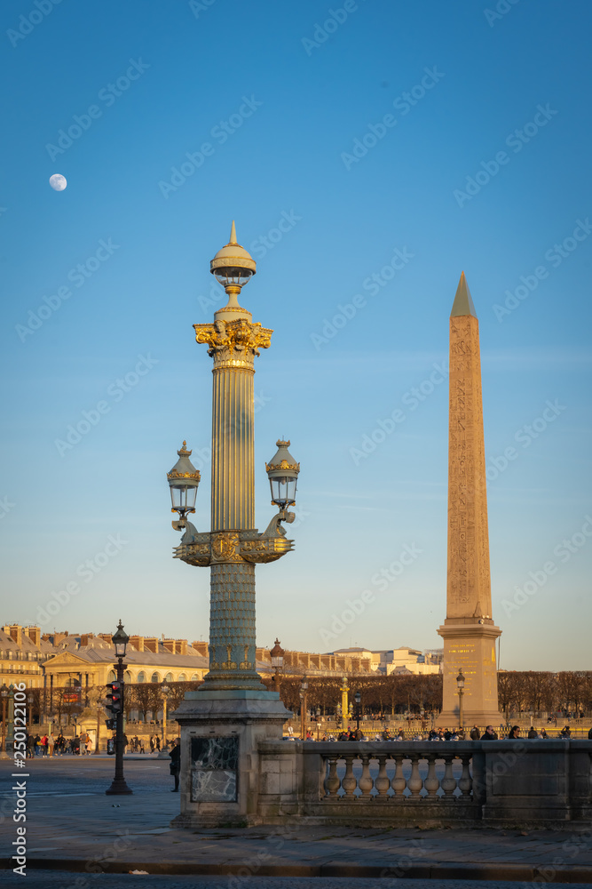 Paris, France - 02 17 2019: Place de la Concorde and the Obelisk of Luxor and the moon