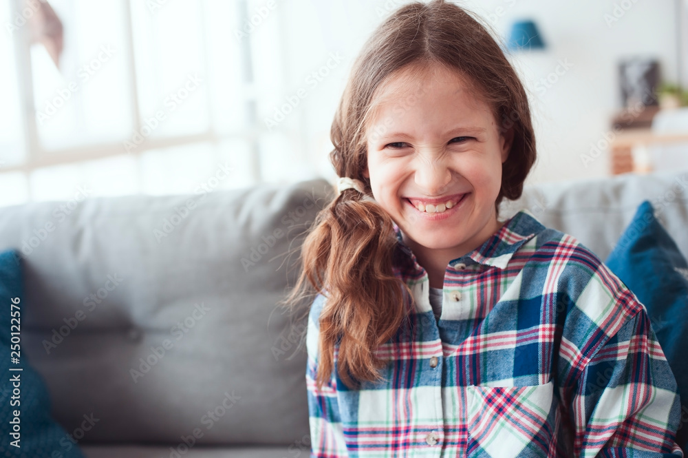indoor portrait iof naughty kid girl laughing. Happy funny artistic child indoor portrait iof naughty kid girl laughing. Happy funny artistic child