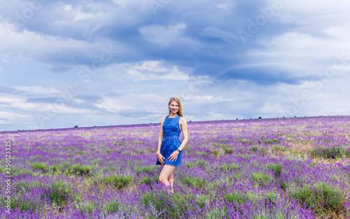 Wallpaper Mural Girl in blue dress on lavender field in cloudy weather Torontodigital.ca