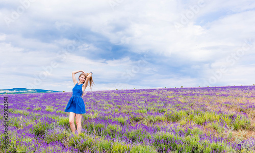 Wallpaper Mural Girl in blue dress on lavender field in cloudy weather Torontodigital.ca
