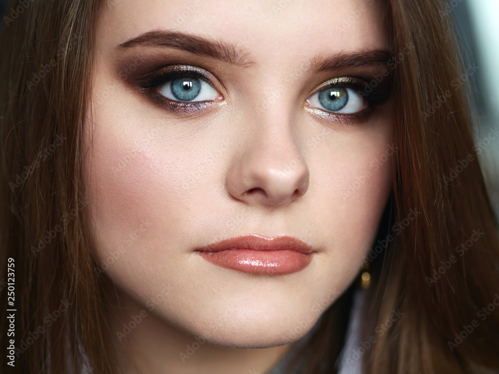 Young beautiful woman with professional make up and hairstyle with Young beautiful woman with professional make up and hairstyle with