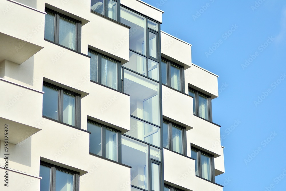 Modern white building with balcony on a blue sky Modern white building with balcony on a blue sky