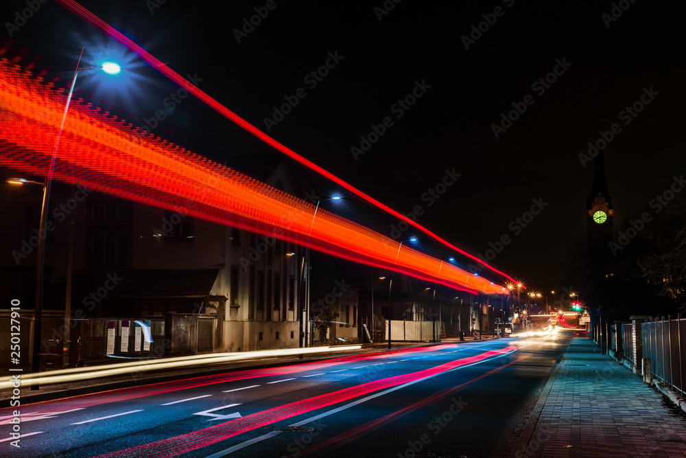 Night view of bus lights trace on the city road, Strasbourg, France