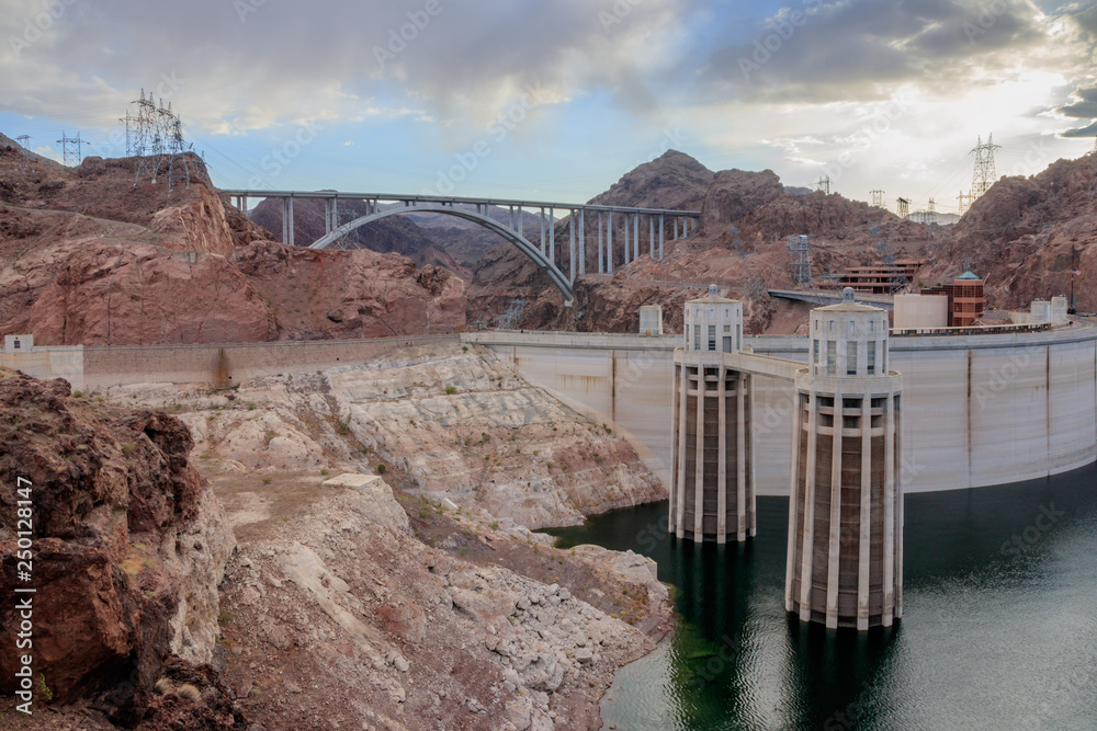 Hoover Dam is a concrete arch-gravity dam in the Black Canyon of the  Colorado River, on the border between the U.S. states of Nevada and  Arizona. It is Hydroelectric power station Stock
