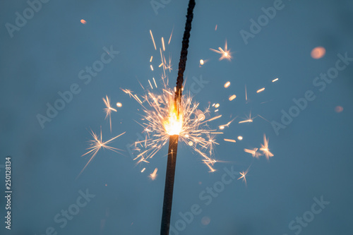 Cold sparklers on a blue background