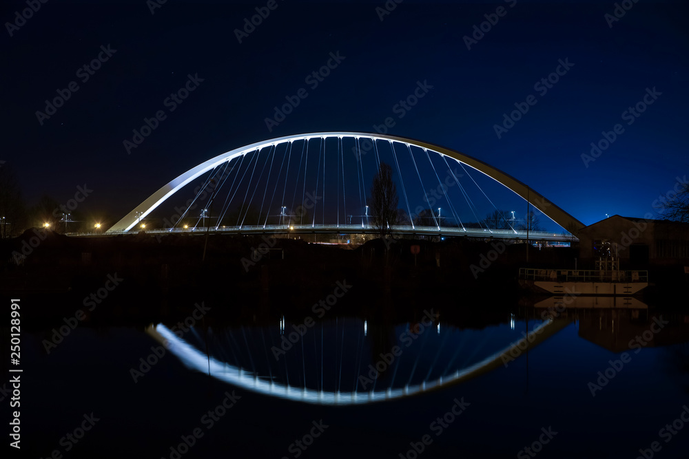 Citadelle Bridge across Bassin Vauban for trams and bicycles. Night view.