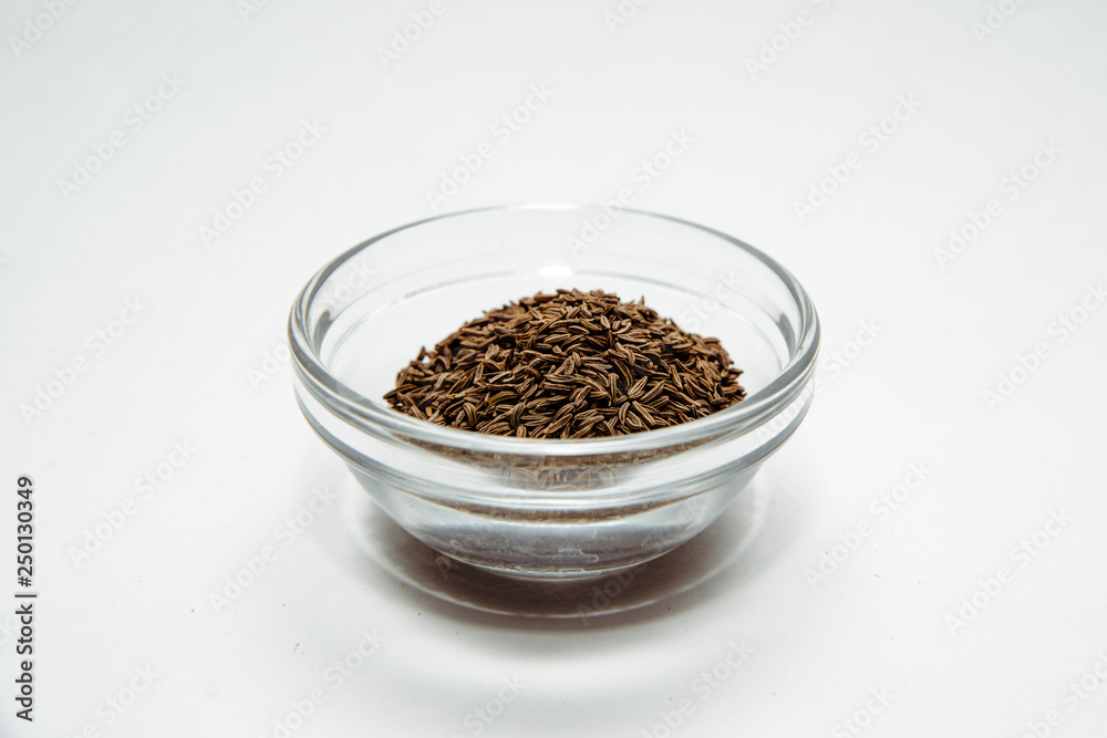 Cumin isolated on a white background. Cumin placed on the table. The concept of using seasonings for dishes. Eating spiced dishes. Cumin isolated on a white background. Cumin placed on the table. The concept of using seasonings for dishes. Eating spiced dishes.