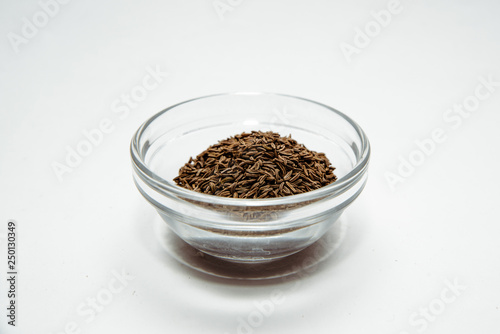 Cumin isolated on a white background. Cumin placed on the table. The concept of using seasonings for dishes. Eating spiced dishes.