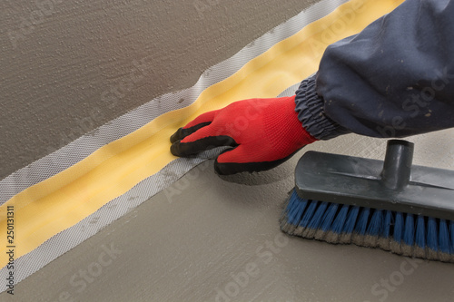 the proper placement of sealing tape, waterproofing tape in the first layer of waterproofing