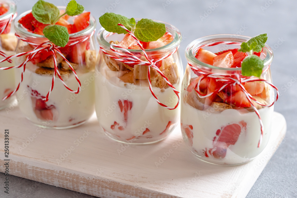 Yogurt with fresh strawberries and crumbled biscuits in a jar. Yogurt with fresh strawberries and crumbled biscuits in a jar.