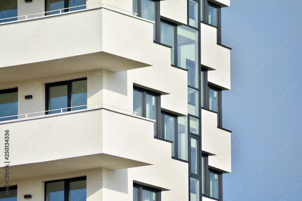 Modern white building with balcony on a blue sky Modern white building with balcony on a blue sky