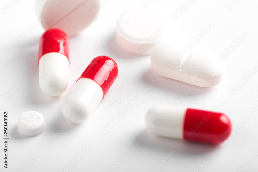 Assorted pharmaceutical medicine pills, tablets and capsules.Pills background. Assorted pharmaceutical medicine pills, tablets and capsules.Pills background.