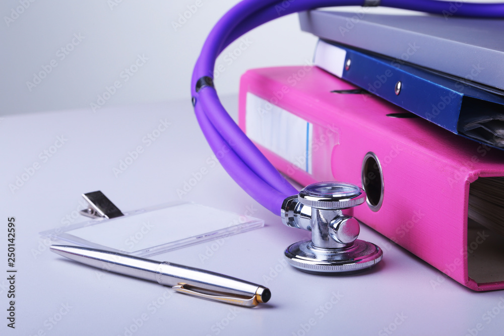 Folder file, stethoscope and RX prescription on the desk. blurred background. Folder file, stethoscope and RX prescription on the desk. blurred background.