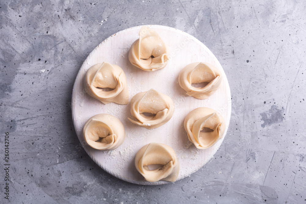 Raw wonton, Chinese dish made from dough and fillings Raw wonton, Chinese dish made from dough and fillings