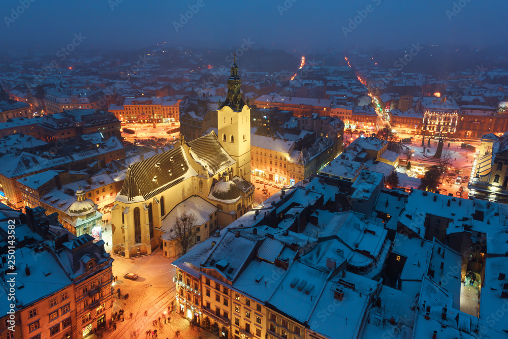 Lviv in winter time. Picturesque evening view on city center from top of town hall. Eastern Europe, Ukraine