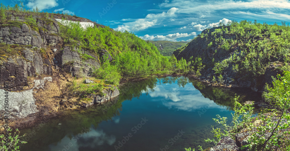 Mountain lake in the rocks in the Khibiny