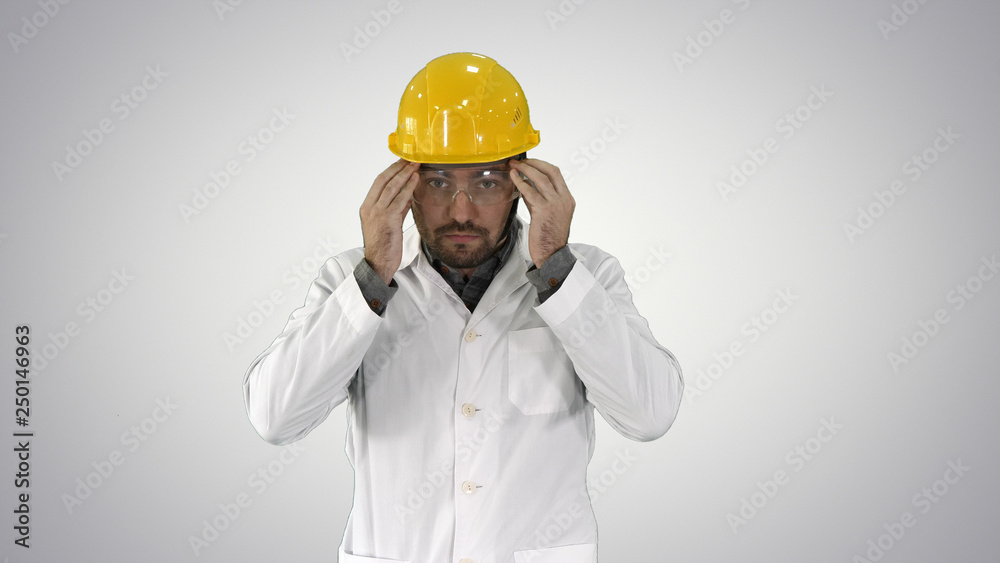 Transparent safety glasses in hand Worker trying on protective glasses on gradient background. Transparent safety glasses in hand Worker trying on protective glasses on gradient background.