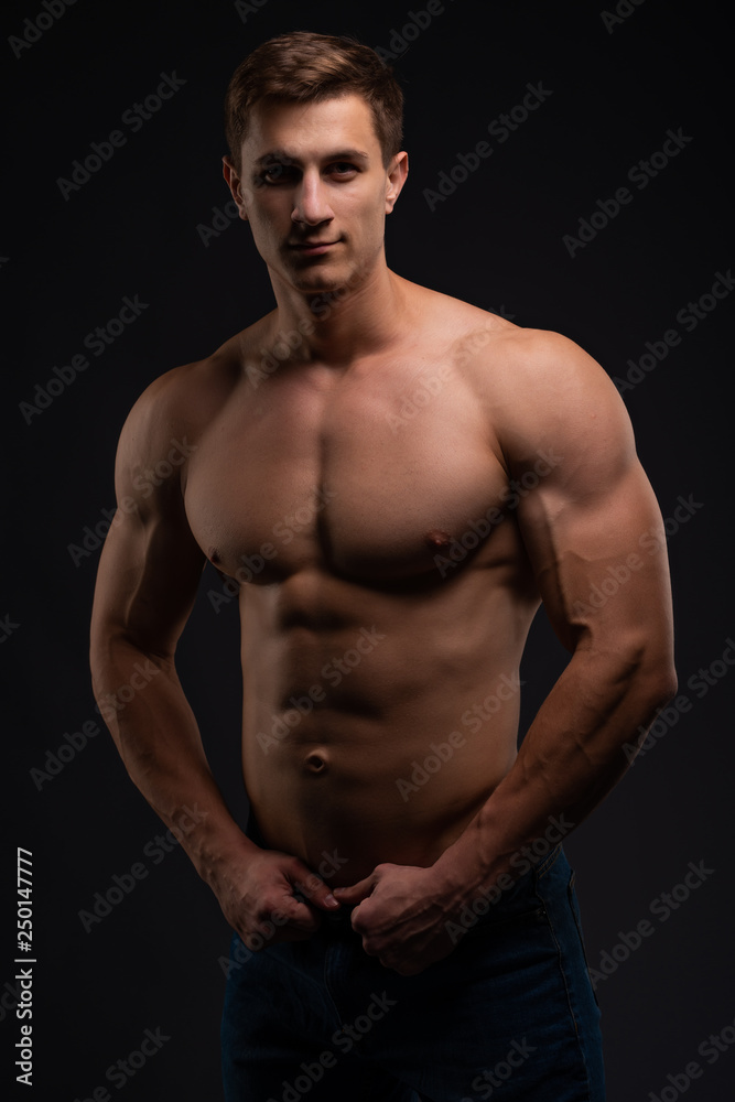 Athlete, bodybuilder, on black. Gym advertising, fitness, sports club. Healthy lifestyle concept