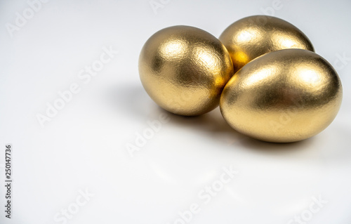 background, postcard, with three Golden eggs on white background for text input