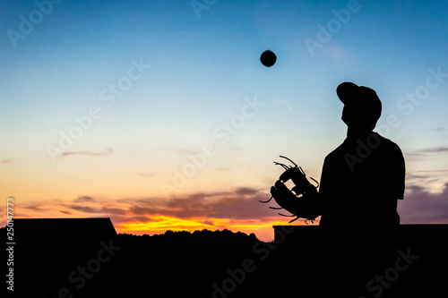 Photography baseball silhouette tossing ball against sunset