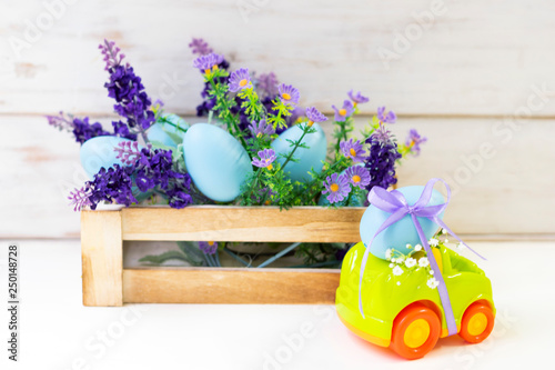 Easter cars with an egg on a white background, the concept of the approaching easter