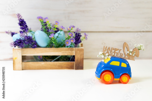 Easter cars with the words  ''Happy Easter'' on a white background, the concept of the approaching easter