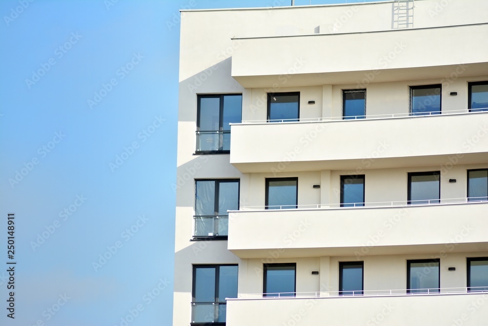 Modern white building with balcony on a blue sky Modern white building with balcony on a blue sky