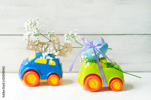 Easter car with egg and easter car with the words  ''Happy Easter'' on the white background 