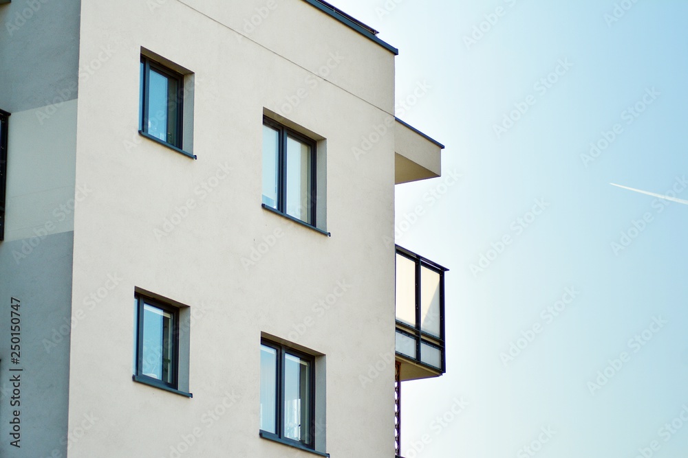 Modern white building with balcony on a blue sky Modern white building with balcony on a blue sky