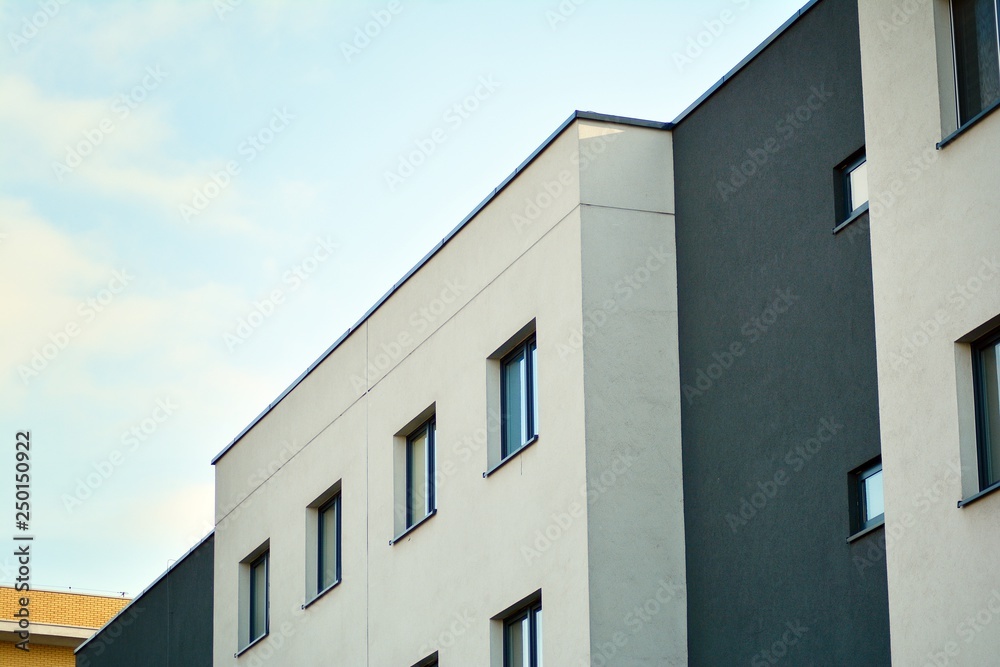 Modern white building with balcony on a blue sky Modern white building with balcony on a blue sky