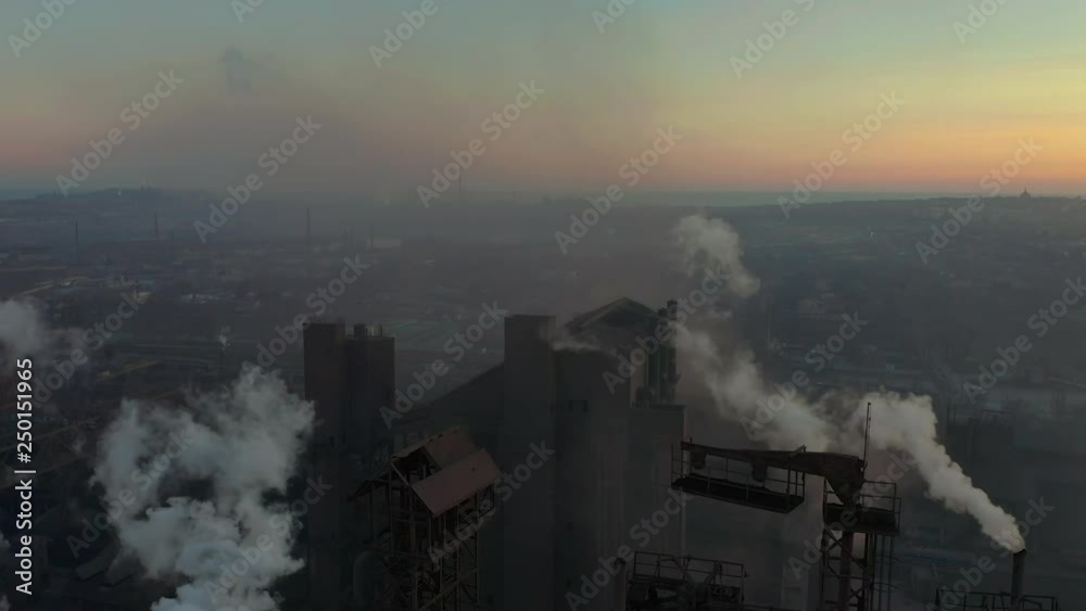 Blast furnace view from the air. Old factory. Aerial view over industrialized city with air atmosphere pollution from metallurgical plant. Blast furnace view from the air. Old factory. Aerial view over industrialized city with air atmosphere pollution from metallurgical plant.