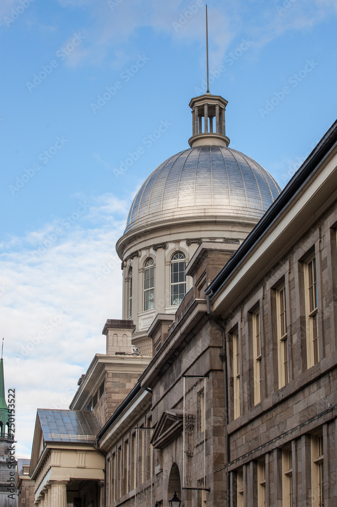 Marche Bonsecours in Montreal, Quebec, Canada, during a sunny afternoon, with the old coat of arms of the city. Bonsecours Market is one of the main attractions of Old Montreal, or Vieux Montreal Marche Bonsecours in Montreal, Quebec, Canada, during a sunny afternoon, with the old coat of arms of the city. Bonsecours Market is one of the main attractions of Old Montreal, or Vieux Montreal