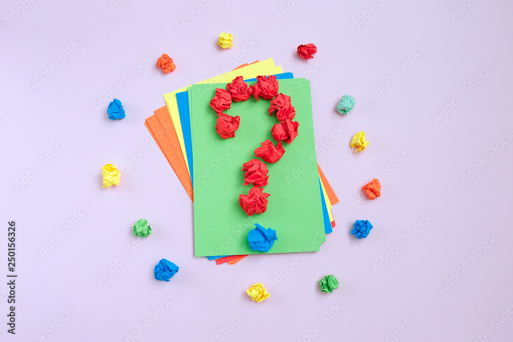Question mark lined with crumpled paper on colorful background top view copy space Question mark lined with crumpled paper on colorful background top view copy space
