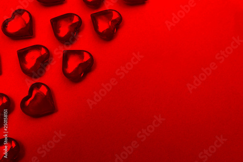 Texture red hearts on a red background