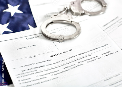 Fotografie Arrest Warrant Court papers with Handcuffs