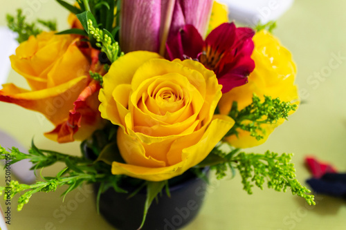 Yellow roses bunch isolated whit red lilas