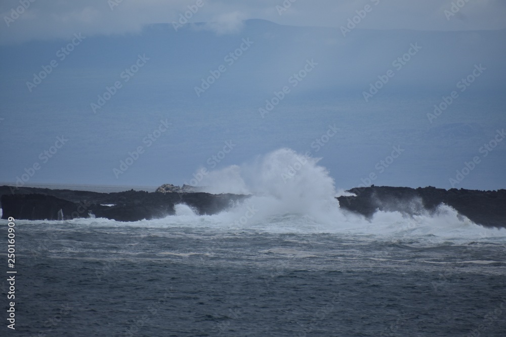 Huge wave breaking on the rocks