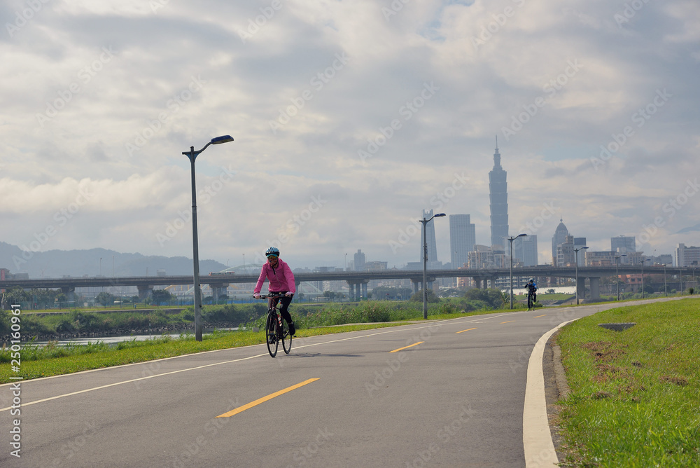 People riding bicycles in the morning.