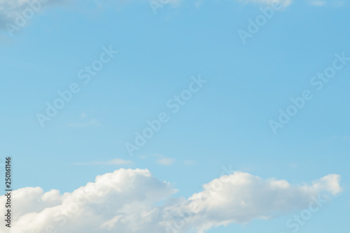 Soft clouds. Beautiful sky background. Blue sky with white clouds. Clear day and good weather.