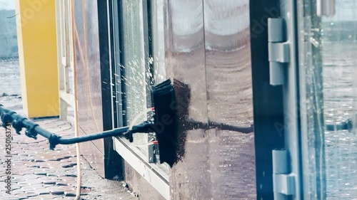 Window washer cleaning building facade