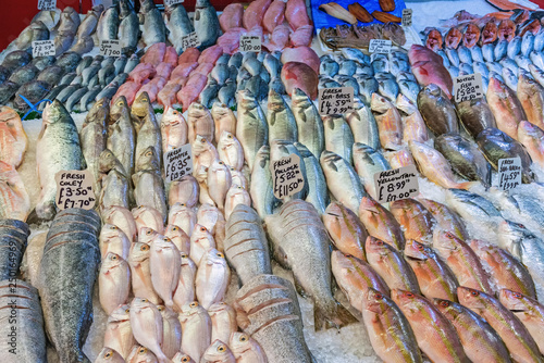 Great selection of fresh fish for sale at a market in Brixton, London photo