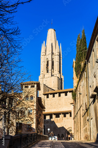 Bell tower of Collegiate Church of St. Felix from Pujada de Sant Feliu street photo