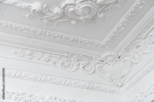 Beautiful ornate white decorative plaster moldings in studio