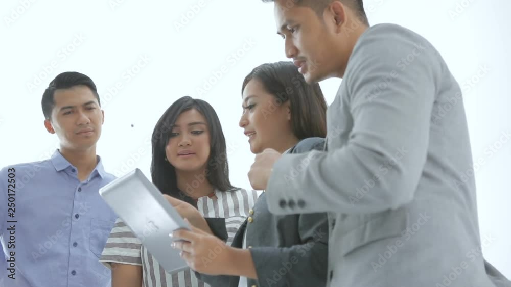 portrait of young business asian people using tablet pc together portrait of young business asian people using tablet pc together