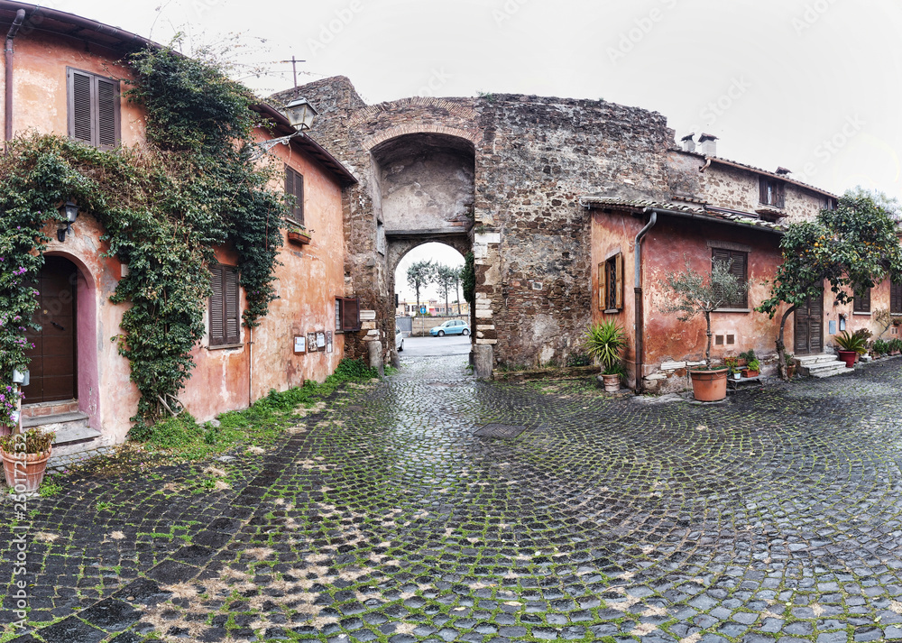 andscape of Medieval village of Ostia Antica and the view of the ancient entrance, shooting in a cloudy winter day