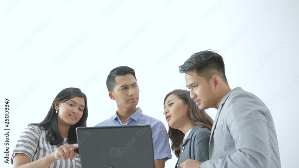 Portrait of young couple business people meeting using laptop together with team Portrait of young couple business people meeting using laptop together with team