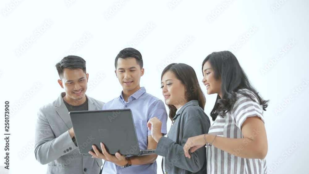 Portrait of young couple business people meeting using laptop together with team Portrait of young couple business people meeting using laptop together with team