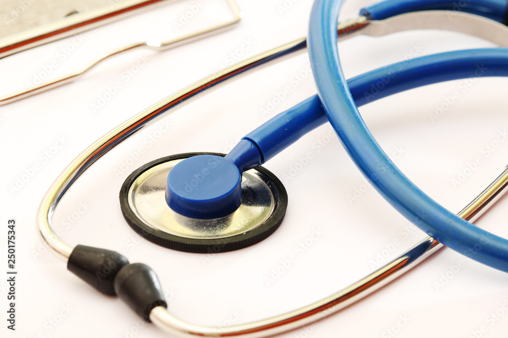 A stethoscope and a clipboard for notes as a medical check concept A stethoscope and a clipboard for notes as a medical check concept