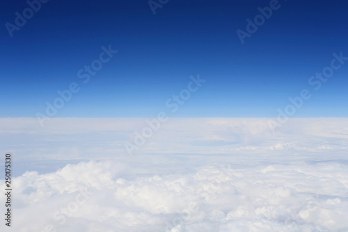 Beautiful natural cloudscape. Blue sky and clouds airplane